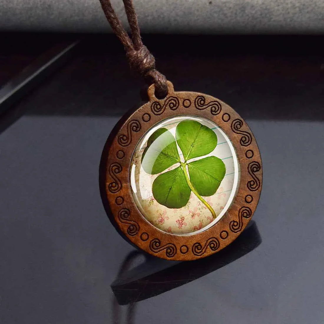 Four leaf clover pressed on aged parchment under glass dome wooden pendant necklace — Pedlar's Attic