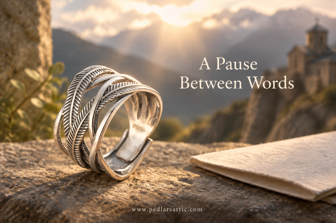 925 sterling silver Angel Feather ring from the High Monastery beside a folded note, for A Pause Between Words at Pedlar’s Attic